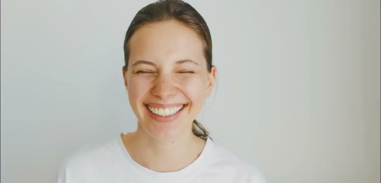 A patient laughing after a visit